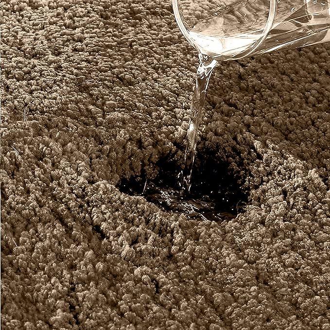 Water being poured onto a thick, absorbent bathmat to show water absorption
