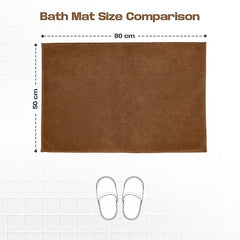 Brown bath mat size 50x80 cm on tiled floor with slippers for scale