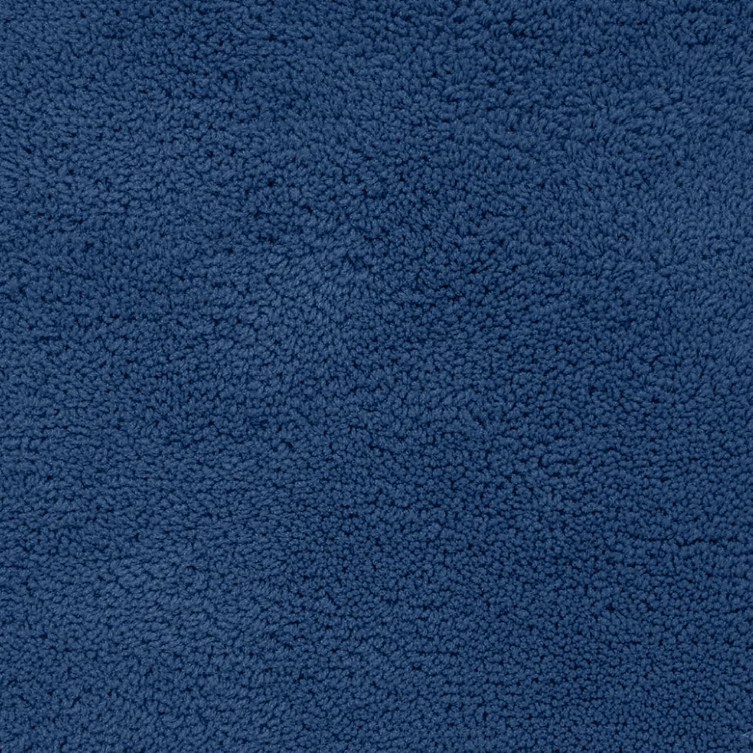Soft textured blue bathmat surface, plush fabric home essential