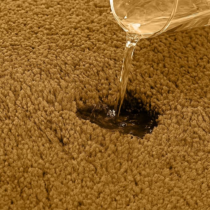 Water being poured onto a brown absorbent bathmat, showing its water absorption feature
