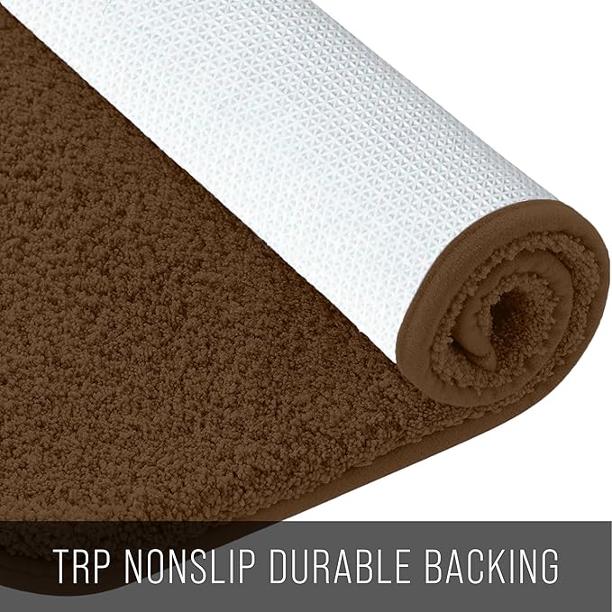 Brown bathmat with textured non-slip backing, rolled to show soft pile and durable base