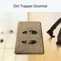 Beige dirt trapper doormat with black footprint prints at entryway, catching dirt from shoes.