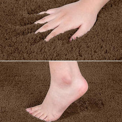 Hand and foot pressing on soft brown bathmat, showing plush texture and comfort.