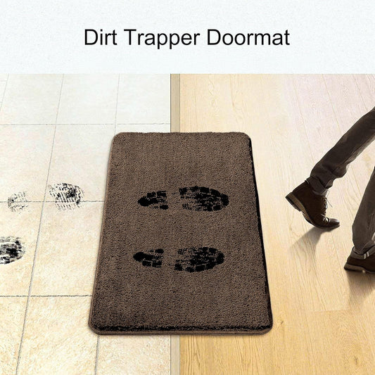 Brown dirt trapper doormat with muddy footprints on tile and a person stepping onto it