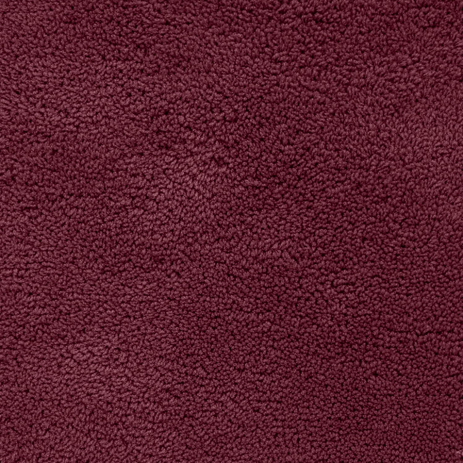 Plush maroon bathmat with a soft, textured surface