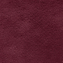 Plush maroon bathmat with a soft, textured surface