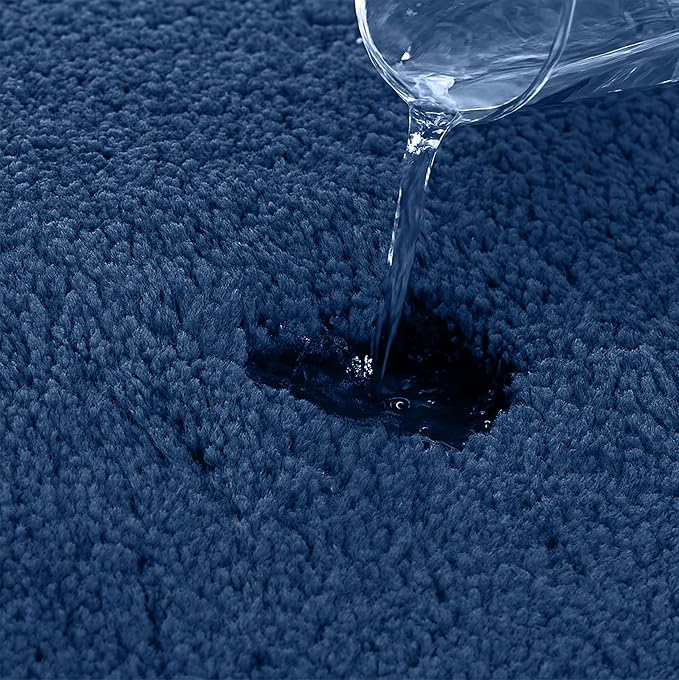 Water being poured onto a blue absorbent bathmat to show water resistance