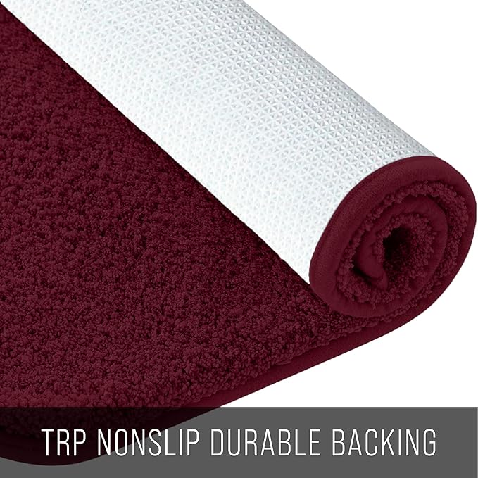 Maroon bathmat with white nonslip TRP backing, soft texture, rolled up for display
