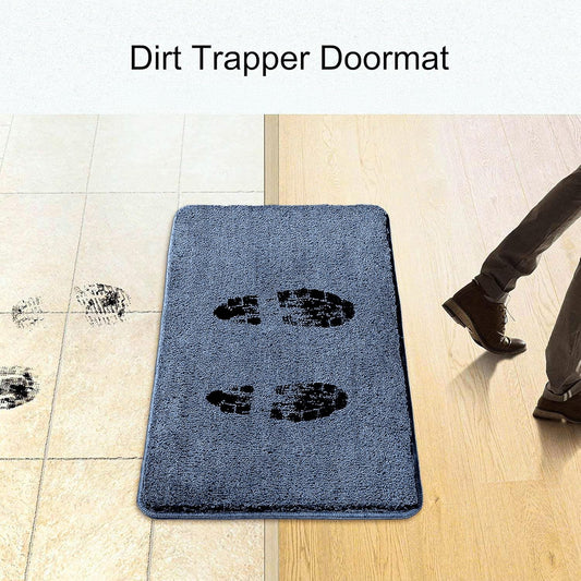 Dirt trapper doormat on floor with muddy shoe prints, capturing dirt at doorway entrance