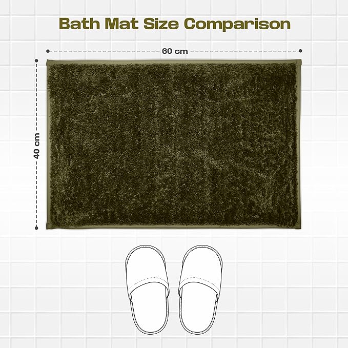Dark green bath mat 60x40 cm on white tile with slippers for size comparison