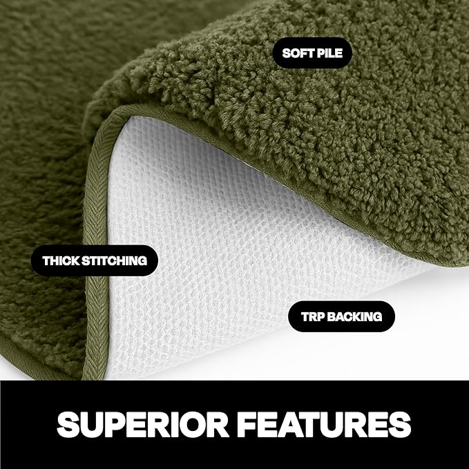 Green bathmat with soft pile, thick stitching, and TRP backing, close-up view