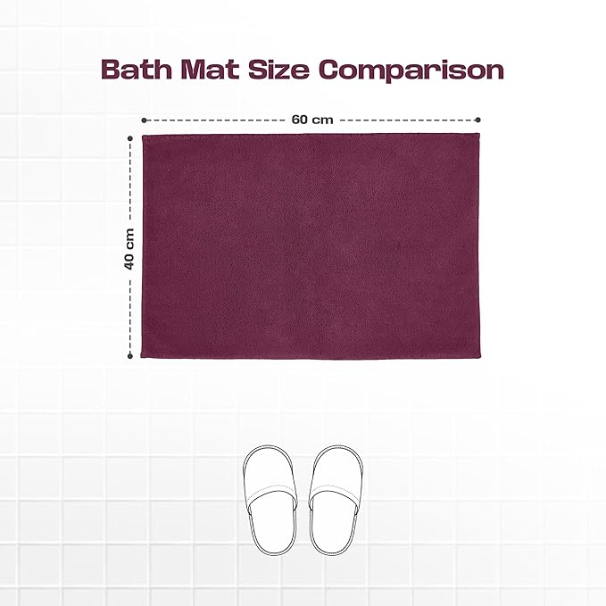 Maroon bath mat size comparison, 60x40 cm, on white tile with slippers illustration