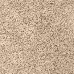 Close-up of a beige, soft, textured bathmat surface for bathroom decor