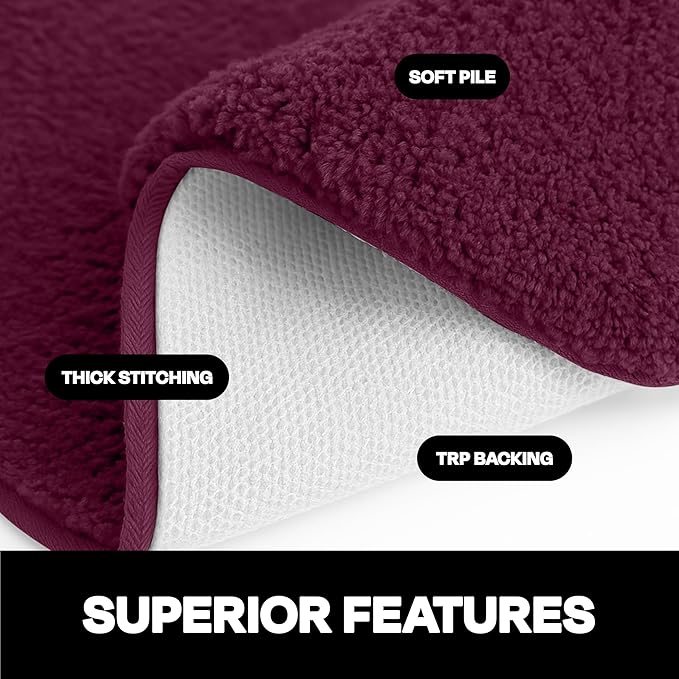 Close-up of a maroon bathmat with soft pile, thick stitching, and TRP backing