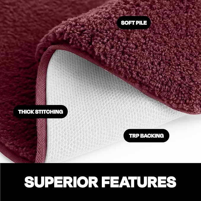 Close-up maroon bathmat with soft pile, thick stitching, and TRP anti-slip backing
