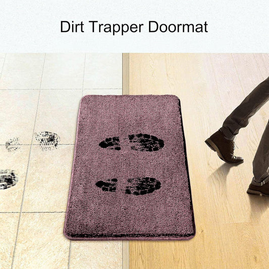 Dirt trapper doormat on floor, showing muddy footprints and clean area, ideal for entryway.