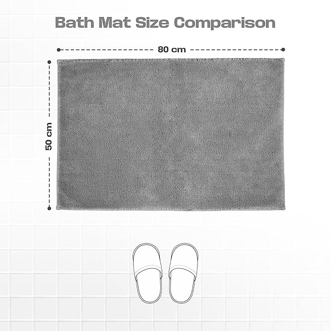 Grey bath mat 50x80 cm on tiled floor with slippers, size comparison visual