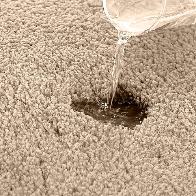 Water being poured onto a beige, absorbent bathmat to show its water resistance